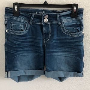 Dark blue jean shorts, embellished.